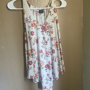 White sleeveless flower shirt